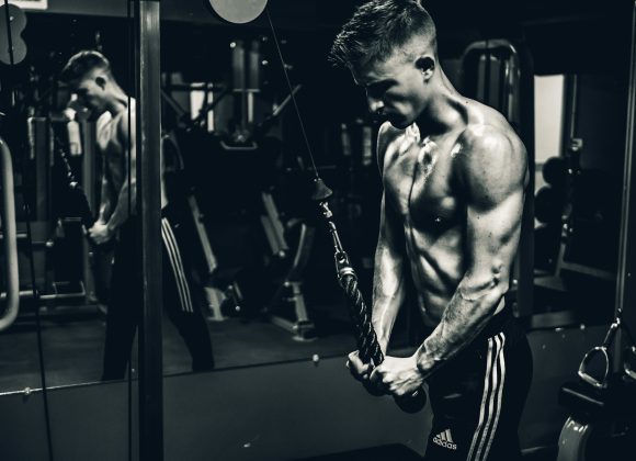 grayscale photo of man exercising